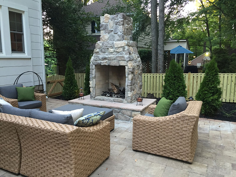 Backyard Fireplace, Hearth, Paver Patio, and Seating Area