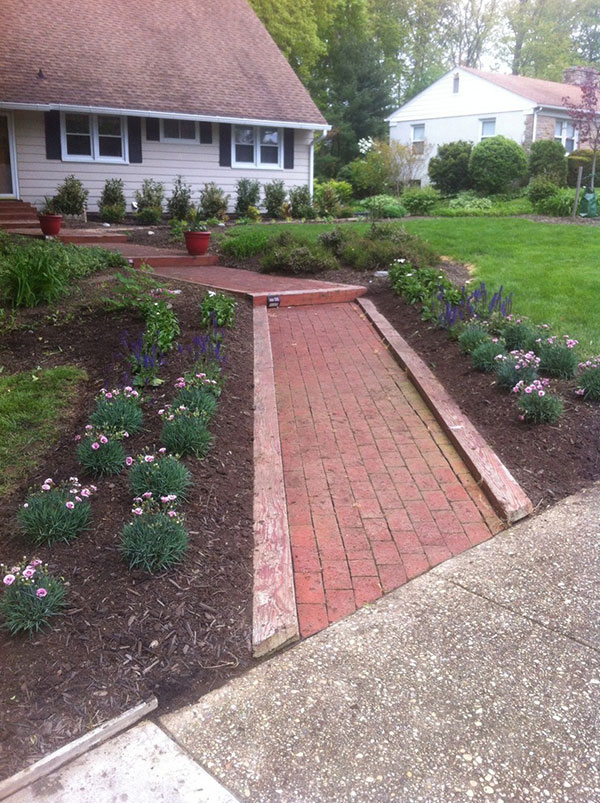 New Plants Installed on Either Side of Front Walkway